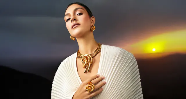 The Psychology Behind the Bold Gold Jewelry We Admire But Don't Buy