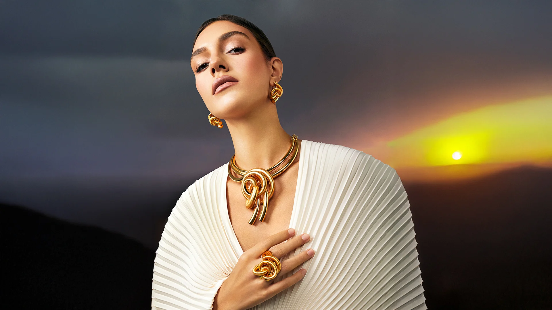 The Psychology Behind the Bold Gold Jewelry We Admire But Don't Buy